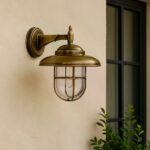 Messing Monte buitenwandlamp met helder glas en beschermraster
