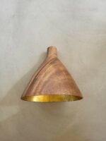 Goblet-shaped acacia wood pendant light with a gold-leaf coloured interior